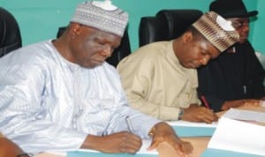 National President, National Union of Road Transport Workers (NURTW), Alhaji NajeemYasin (left), and Executive Secretary, National Primary Healthcare Development Agency, Dr Ado Mohammad, signing a Memorandum of Understanding (MoU)  on a Pilot Emergency Transport Scheme in Abuja, recently. 