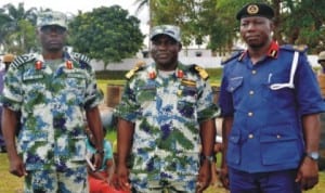 L-R: Executive Officer, NNS Pathfinder, Capt. Sam Bura, Commander, Commodore Godwin Ochai and Deputy Commandant and Head of Operations, Nigeria Security and Civil Defence Corps (NSCDC), Rivers State, Mr Olowoyotan Bamidele, during hand over of 7 suspects and 250 drums of illegally refined diesel to NSCDC in Port Harcourt, recently.