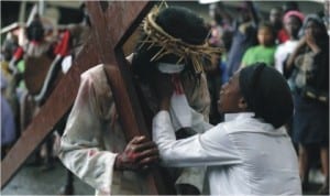 Catholic faithful performing a re-enactment of the death of Jesus Christ, on Good Friday in Lagos.Jesus Christ resurrected on Easter Sunday 