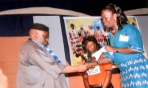 Executive Director of the Rivers State Council for Arts and Culture, Chief Deede Baede, receiving an award on behalf of Captain Elechi Amadi, presented by Rivers State Chairman of RATTAWU, Mrs O. P. Erekosimia during the 2014 edition of World Theatre Day in Port Harcourt, recently.