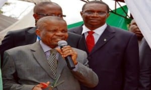 Representative of Minister of Industry, Mr Samuel Eya, cutting the tape to declare open the 25th Enugu International Trade Fair in Enugu last Friday. With him is representative of Enugu State Government, Mr Ugwu Egede. Photo: NAN