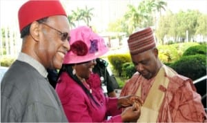 Vice President Namadi Sambo (right), being decorated by the Chairman, Federal Civil Service Commission, Deaconess Joan Ayo, at the 60th Anniversary of  Nigerian Public Service and Presidential Lecture in Abuja, yesterday . Left is the Chairman of the  anniversary, Chief Emeka Anyaoku.