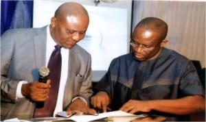 Permanent Secretary, Ministry of Budget &Economic Planning, Sir Promise Njiowhor (left) examining a document with the ministry’s Project Coordinator, Precious Amos at the SEEFOR TVAT training on grant management and administration in Port Harcourt, yesterday. Photo: Chris Monyanaga
