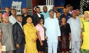 Governor  Babatunde Fashola of Lagos State (5th left), Deputy Governor, Mrs Adejoke Orelope-Adefulire(3rd left), Commissioner for Housing, Mr Bosun Jeje ( left), Commissioner for Finance, Mr Ayo Gbeleyi (2nd left) and winners of 2nd batch of Lagos home ownership mortgage scheme at the mortgage draw in Lagos recently.