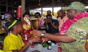 OPM’s General-Overseer, Apostle Chibuzor Chinyere (right) presenting trophy to Ivory House, winners of the first OPM Free Nursery/Primary School’s Inter-House Sports Competition, last Monday.
