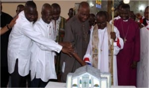 L-R:Senator Magnus Abe, Hon. Andrew  Uchendu, Rivers State Governor, Chibuike Amaechi and Bishop, Rivers Diocese, First African Church,   Rt. Rev. S. O. Matilukuro, during the cutting of the cake to mark the 90th anniversary of the mission and dedication of the new church cathedral building in Government House, Port Harcourt at the weekend