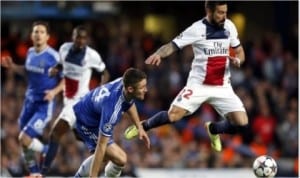 PSG’s Ezequid Larezzi (right) trying to evade Chelsea’s Gary Cahill in the UEFA Champions League 1/4 final second leg match last night