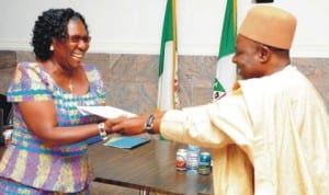 Plateau Head of Service, Mr Ezekiel Dalyop (right), presenting certificate of participation to the Commissioner for Science and Technology, Mrs Comfort Piwuna, at the close of Information Technology (it) training for commissioners and top government officials in Jos last Wednesday. Photo: NAN