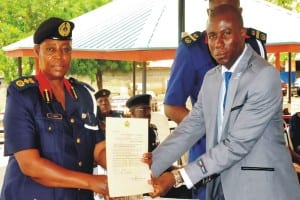 Deputy Commandant-General, Technical Services, Mrs Patience Agbiki (left),presenting private guards companies (pgc) licence to Director-General, Maritime and Land Security services, Prince Idodo Friday in Abuja last Wednesday. Photo: NAN. 