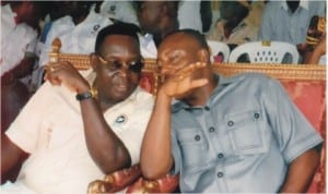 Rivers State Commissioner for Rehabilitation and Social Welfare, Hon Joe Poroma (left) chatting with Commissioner for Sports, Hon Fred Igwe, during 2014 Workers Day celebration in Port Harcourt, last Thursday. Photo: Obinna Dele