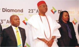 L-R: Group Managing Director, Diamond Bank, Dr Alex Otti, Chairman and Obi of Onilsha, Nnaekeka Achebe and Secretary of the bank, Nkechi Nwosu, during the 23rd Annual General Meeting of the bank in Lagos, recently.