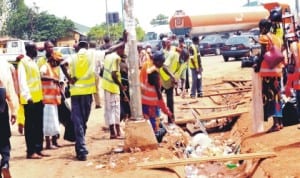 Environmental Sanitation Workers Cleaning the scene of the Nyanya explosion in Abuja last Friday. Photo: NAN