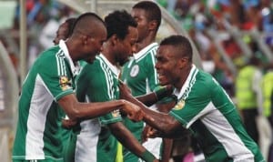 Super Eagles striker, Emmanuel Emenike (right) leads mates in celebration after scoring enroute to Brazil 2014 World Cup