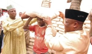 Executive Secretary, Gombe State Emergency Management Agency, Dr Arab Rukuje (right), with the Head, Department of Education and Social Development, Billiri Local Government Area, Malam Ibrahim Puma, presenting relief materials to victims of  windstorm in Gombe State recently. Photo: NAN.