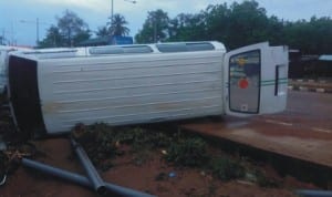 A bus upturned by rainstorm on Ajase Ipo road in Ilorin, recently. Photo: NAN