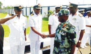 Chief of Naval Staff, Vice Adm. Usman Jibril (right), being received by naval personnel at the  headquarters of the Nigerian Navy Logistics Command in Oghara, Delta State, last Monday. Photo: NAN