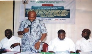 Chairman, House Committee on Chieftaincy and Conucil of Chiefs Bill 2014, Hon Chidi Lloyd (standing), making opening remark.  Other members of the committee, Hon (Dr) Sam Eligwe (right), Hon Robinson Ewor  (2nd  right), Hon Ibiso Nwuchen (left) at the public hearing of the Rivers State Chieftaincy and Conucil of Chiefs Bill in Port Harcourt. Photo: Chris Monyanaga