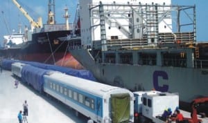 New air-conditioned long distance coaches belonging to the Nigeria Railway Corporation being offloaded at the Apapa Port Complex in Lagos, recently.Photo: NAN