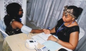 An Attendant of DibetiCare International Foundation, Chinenye Iheanachor (right), conducting a diabetic test, during the foundation’s seminar in Port Harcourt, recently.