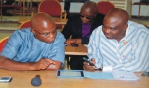 Member representing Khana Constituency I,  Hon.  Legbosi Nwidadah (left) confering with Hon. Golden Chioma, representing Etche Constituency I (right) at the sitting of the House,  last Wednesday. Photo: Chris Monyanaga.