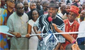 Rivers State Deputy Governor, Engr Tele Ikuru, representing Governor Amaechi cutting the tape to officially commission the Port Harcourt Local Government Council Legislative building. With him are Mayor of Port Harcourt, Chimbeko Akarolo and Eze Victor N Woluchem,  Eze Epara Rebisi XII and other dignitaries, during the commissioning, last Tuesday