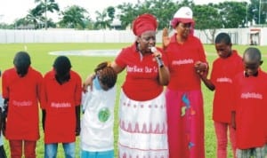 Wife of the Rivers State Governor, Dame Judith Amaechi with children interceding in prayer for the release of the Chibok Girls, during the Children's Day celebration at Government House, Port Harcourt, last Tuesday. Photo: NAN