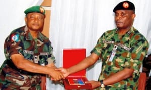 Commander, Joint Task Force (jtf) in the Niger Delta, Maj.-Gen. Emmanuel Atawe (left), presenting a plaque to visiting Army Chief of Training and Operations, Maj.-Gen. Ebibowei Awala, at it’s headquarters, Opollo in Yenagoa, recently. Photo: NAN