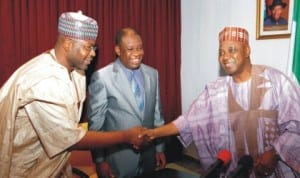 Vice President Namadi Sambo (right), in a handshake with the Minister of State for Power, Mohammed Wakil (left), during a courtesy visit by North South Power Limited Executives in Abuja last Wednesday. With them is the Minister of Power, Prof. Chinedu Nebo. Photo: NAN