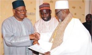 President Goodluck Jonathan (left) receiving a letter from the Khalifah Sheikh, Ahmed Tijani Inyass (right) who visited the Presidential Villa, Abuja last  Saturday.  With them is the son of the Sheikh, Ahmed-Tijani Awalu.