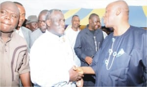 Rivers State Governor, Chibuike Amaechi (right) condoling Sen. Wilson Ake over the death of his mother.