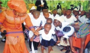 Permanent Secretary, Ministry of Commerce and Industry, and founder, Brown’s Orphanage Home, Ms Kadilo Brown (left) dancing with the orphanage children during the One Year Anniversary/Thanksgiving Service at Breakthough Deliverance Ministry, Eliozu, Port Harcourt, recently. Photo: Chris Monyanaga