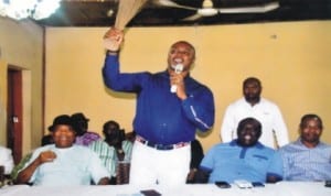 Rivers State Commissioner for Commerce and Industry, Barrister Chinye Chuma (standing), making a speech, during a congress of Non-Indigenes Political Forum in APC, Rivers State chapter in Port Harcourt last Wednesday. With him are State Co-ordinator of the forum, Chief Uchenna Okokoba (2nd right) and Chief Williams Ubaka (left).