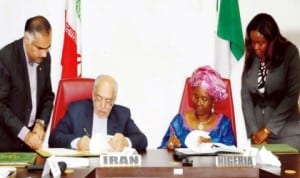 Iranian Minister of Industry, Mines and Trade/Head of Iranian Delegation, Mr Mohammad Nemaizadeh (left) and Minister of State (left) for Foreign Affairs, Prof. Viola Onwuliri, signing Memorandum of Understanding on Tourism, Geology, Mining, Mineral Processing and Industrial Cooperation at the 5th Nigeria-Iran Joint Commission meeting in Abuja last Thursday. Photo: NAN