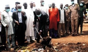 Plateau State Commissioner for Environment, Mr Silvanus Dangtoe, clearing refuse during the launching of Public Health Enlightenment and Sanitation in Jos recently. Photo: NAN