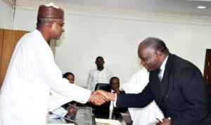  Governor Isa Yuguda of Bauchi State (left), congratulating the new acting Chief Judge of the State, Justice Aliyu Liman, during the swearing-in in Bauchi recently.