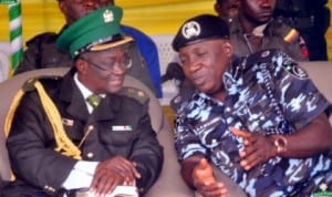 Assistant Commissioner of Police, Mohammed Alli (right) discussing with Patron Nigerian Legion Zone A, Rivers State, Lt. Col. Andrew Osagie during the passing out parade of Batch (B) in Port Harcourt, last week.