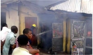 Sympthisers at the scene of a fire incident t No19 Ihediohanma Street Mile 2 Diobu, Port Harcourt, yesterday night. Photo: Fred-Horsfall Adaye