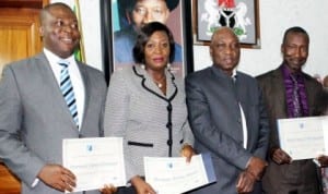 L-R: Chief of Staff to the Managing Director, Federal Airports Authority of  Nigeria (FAAN), Mr Kabir Mohammed, Mrs Vivian Menyanga of the Training Department and Mr Emmanuel Chidera, Airport Operations Department, who were presented certificates by the Managing Director, FAAN, Mr Saleh Dunoma (2nd right), having graduated in Airport Management Professional Accreditation Programme which certifies them as airport managers.