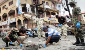 Bomb experts measuring the crater of the bomb blast at a shopping mall on Aminu Kano State Crescent, Wuse 2 in Abuja recently.