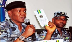Representative of IGPand Force Public Relations Officer, Mr Frank Mba (left), inaugurating counter-terrorism campaign factsheet in Abuja recently. With him is the Deputy Force Public Relations Officer, Mr Abayomi Shogunle. hoto: NAN