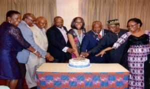 District Governor, Rotary 9140, 2013-2014, Rotarian Charles Uche Onianwa (3rd right), former District Governor, 9140 and former Deputy Governor of Rivers State, Rotarian Sir Gabriel Toby (2nd right), Charter President, Rotary Club of Port Harcourt, Airfield Rotarian Nma Onuigbo (5th left) and other Rotarians cutting the cake during clubs Airfield Charter Certificate Presentation ceremony, in Port Harcourt, recently. Photo: Chris Monyanaga