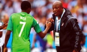 Keshi (right) dishing out instructions to Nigeria’s Ahmed Musa in a match