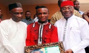 L-R: Deputy Rector, Federal Polytechnic Oko, Dr Don Mmuo, National Coordinator, Nigerian Students  and Youth Mandate, Comrade Ebele Davids on presenting an Award of  Excellent Administrator to the registrar, Federal Polytechnic Oko,Mr Olih Nwaokolobia at Oko, Anambra State, yesterday. 