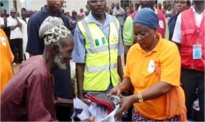 Operations Officer, NEMA Operations Office Gombe, Hajiya Zainab Umar (right), presenting relief materials to an internally displaced person in a camp in Bali, Taraba State, last Saturday.