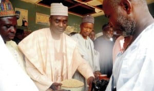 Acting Chairman of Matazu Local Government, Alhaji Mouktar Aminu-Bakori (2nd-left), inaugurating the distribution of bags of grains as Ramadan assistance to the people of the area in Katsina State last Monday. Photo: NAN