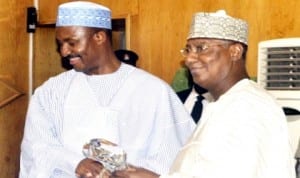 Executive Secretary, National Christian Pilgrims Commission (NCPC), Mr Kennedy Opara (left), presenting a gift to Governor Saidu Dakiingari of Kebbi State, last Monday. Photo: NAN