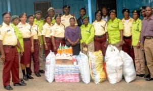 Officials of Lagos State Traffic Management Authority (LASTMA) and Kick Against Indiscipline (KAI), presenting gift items as part of their community outreach programme in Lagos last Wednesday