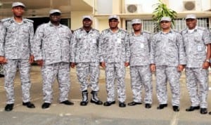 Comptroller-General of Customs, Dikko Abdullahi (4th left), with some members of customs managmeent, unveiling the new camouflage uniform in Abuja last Wednesday..