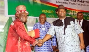 R-L Rivers State Dep Governor, EngrTele Ikuru, in a handshake with former Perm Sec,Chief Gogo Isong, while the Head of Service, Samuel Long-John, watches at the 2014 Rivers State Civil Service Day in Port Harcourt, last Monmday