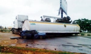 A Petrol Tanker which fell on a Golf Car Across Nyanya-Abuja highway last Saturday.